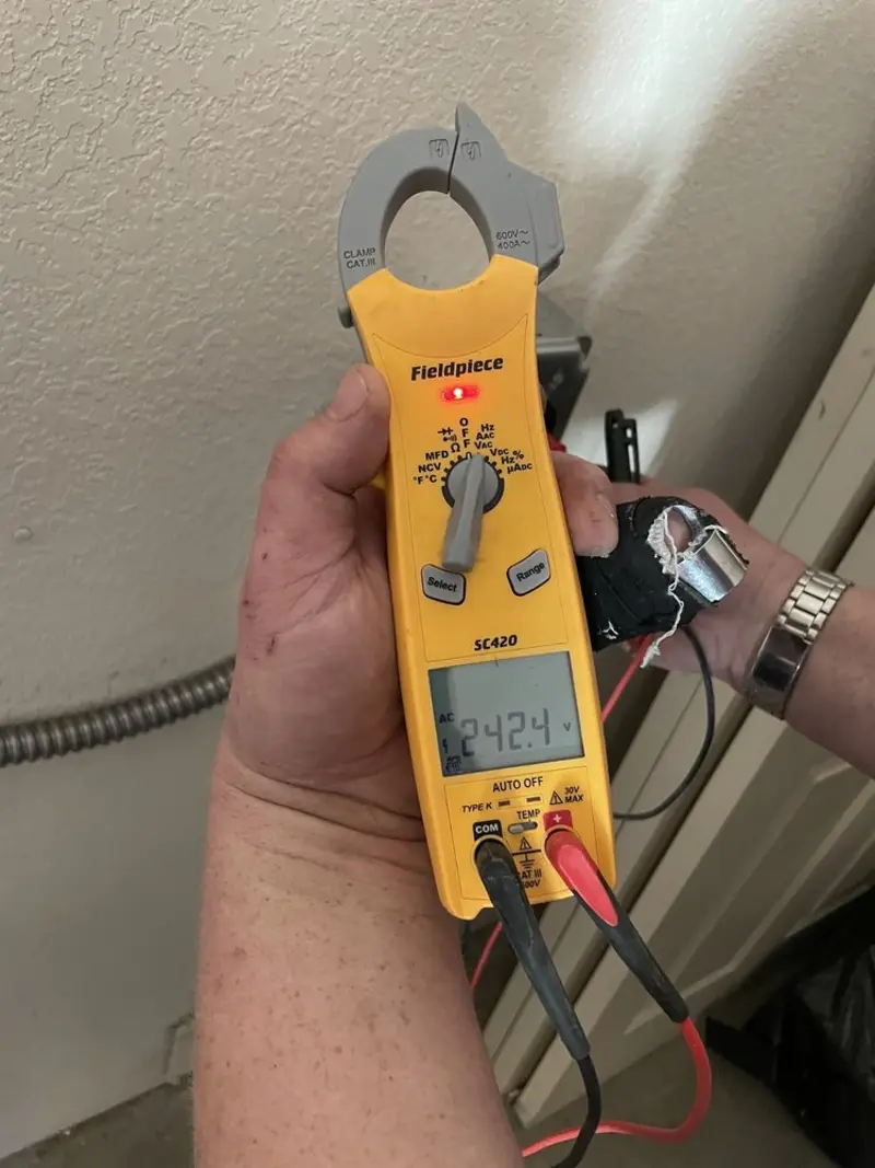 Voltage testing with clamp meter during Aluminum Wiring Replacement in Clayton